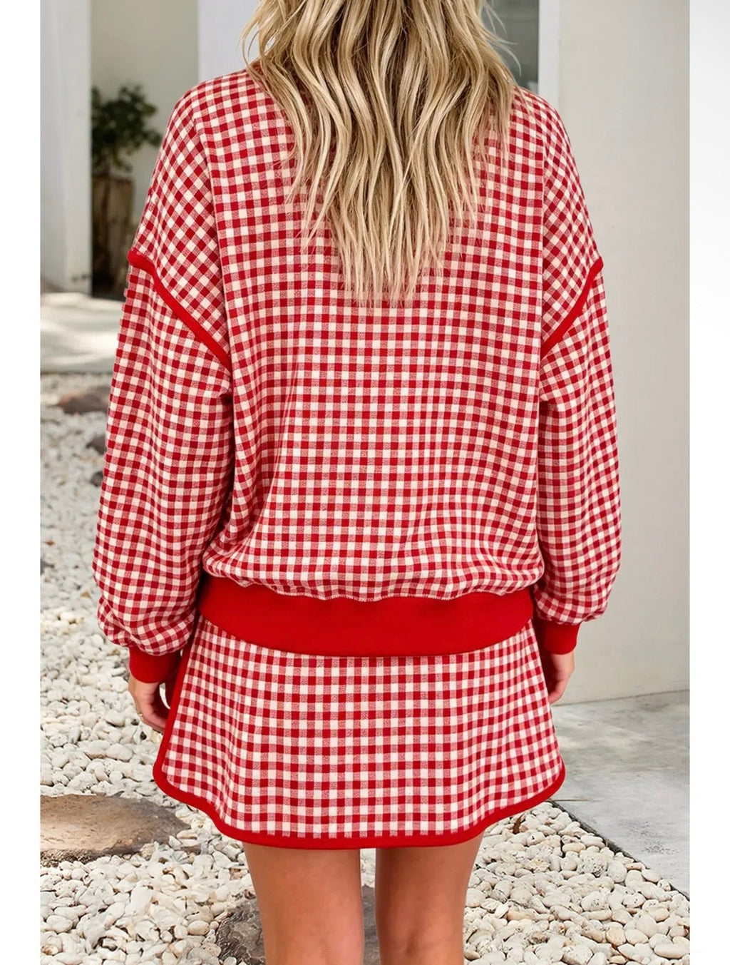 Back view of red and white gingham oversized crew neck top and matching skort set